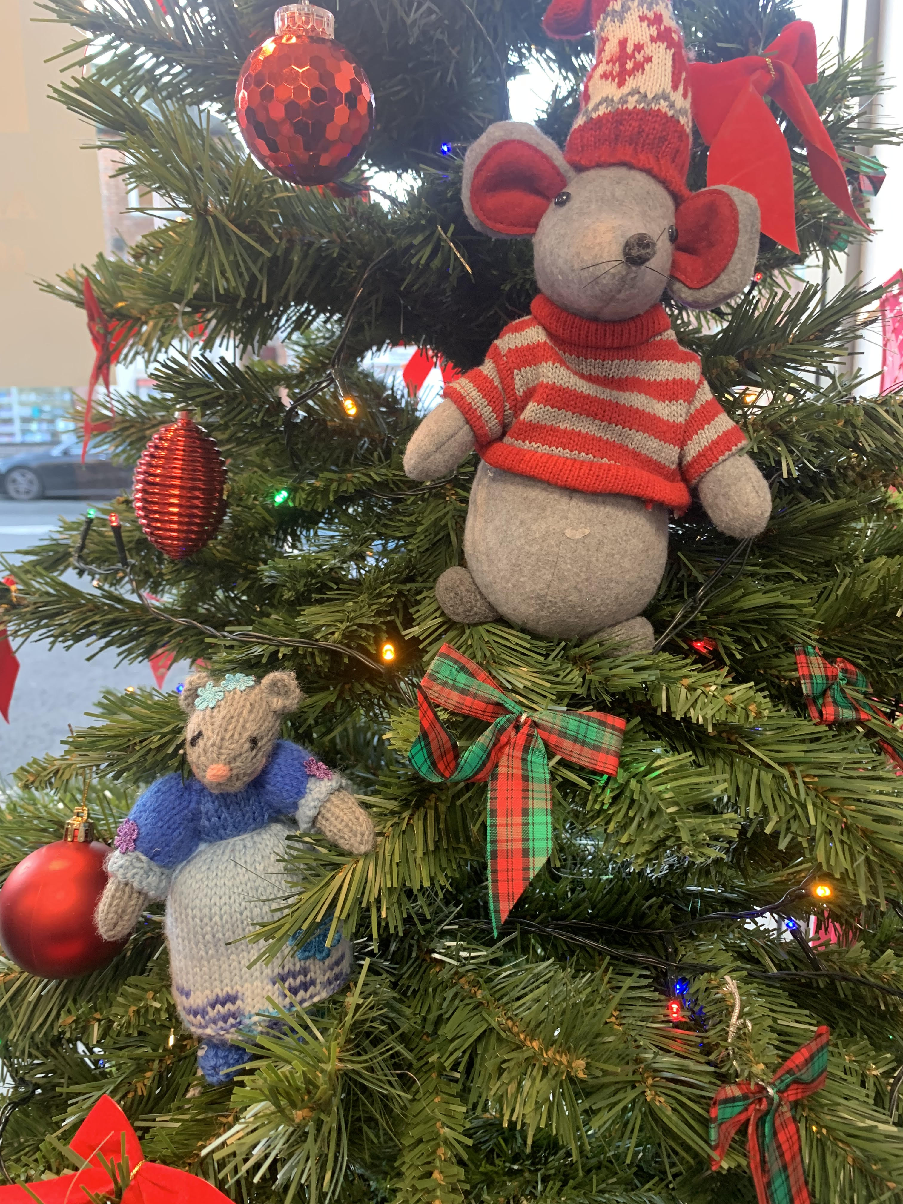 Chris and Hattie hide in the Christmas tree